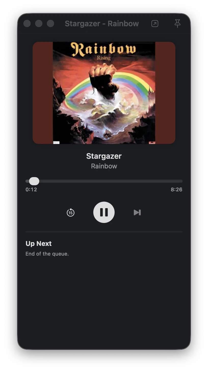 The music player window with album art and Up Next